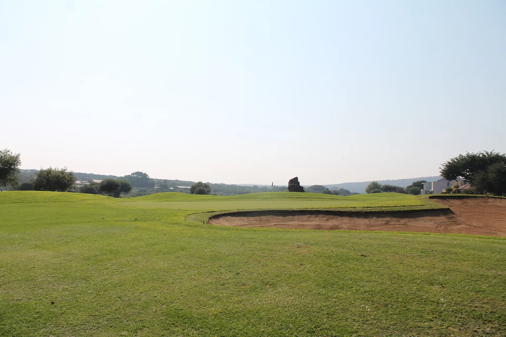 Golfer walking the fairway